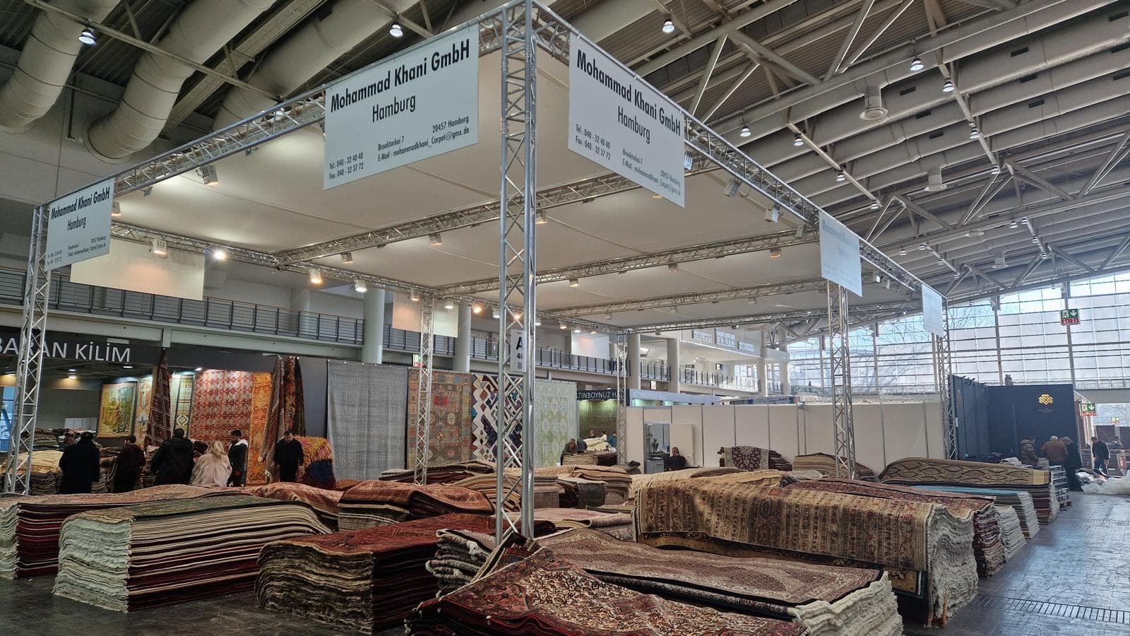 Mohammad Khani GmbH trade fair booth with Persian carpets